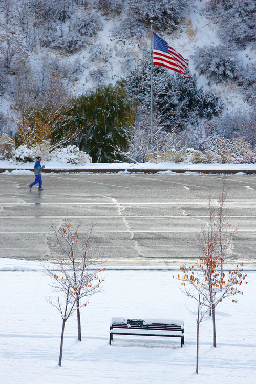 Trent Nelson  |  The Salt Lake Tribune
A woman jogs in a snow-filled scene Tuesday Nov. 5, 2013, near the Capitol building in Salt Lake City.