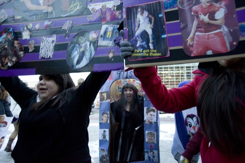 Kim Raff  |  The Salt Lake Tribune
Lelani Candia, left, and Katie Plott, center, gather at the 97.1 ZHT "Show us your Bieber" contest for concert tickets outside the sold-out Justin Bieber concert at EnergySolutions Arena in Salt Lake City on January 5, 2013.