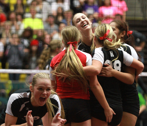Rick Egan  | The Salt Lake Tribune 

Hurricane High celebrates a big score as they come with in two points of winning the their 3A volleyball State Championship title over Desert Hills, Saturday, November 2, 2013.