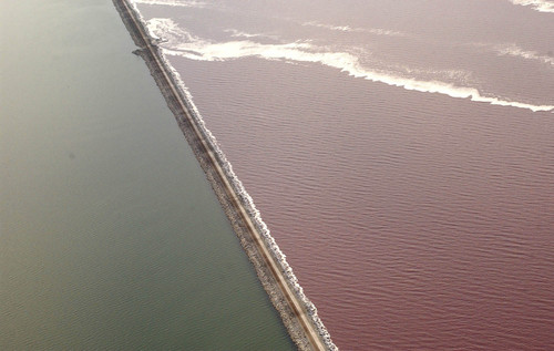 The Union Pacific causeway across the Great Salt Lake separates the super-saline North Arm (right) from the rest of the lake. The last culvert that allows the water to mix could collapse any day, prompting the railroad to seek emergency permission to fill it.    Francisco Kjolseth/The Salt Lake Tribune      08/27/2002