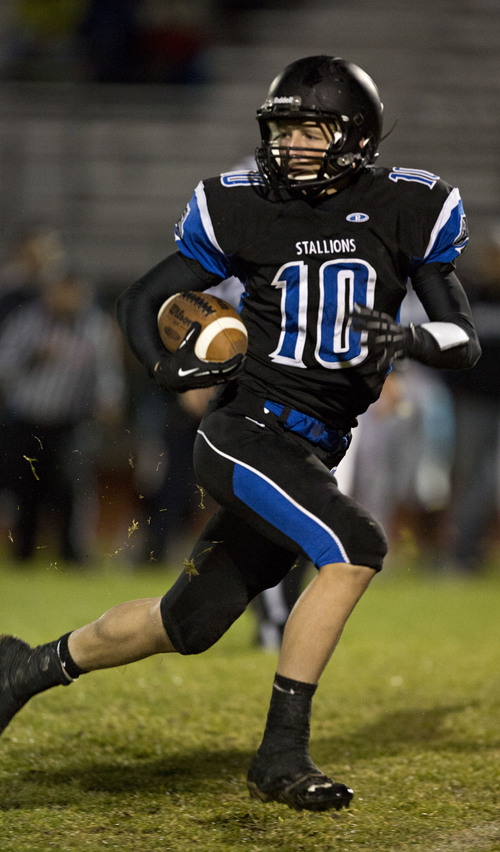 Lennie Mahler  |  The Salt Lake Tribune
Stansbury's Landon Stice runs for a touchdown on a pick six against Juan Diego on Thursday, Oct. 10, 2013.