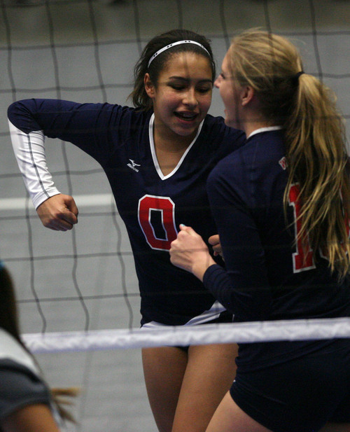 Leah Hogsten  |  The Salt Lake Tribune
Woods Cross' Sarah Smedley and Lacey McEwan celebrate a side out. Woods Cross High School girls played Salem Hills High School during their girls 4A state volleyball quarterfinals Thursday, November 7, 2013 at Utah Valley University's UCCU Center.