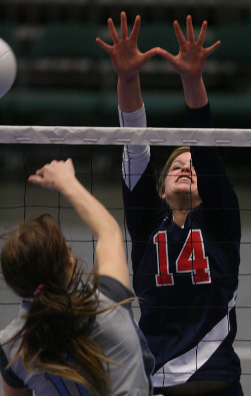 Leah Hogsten  |  The Salt Lake Tribune
Woods Cross' Jessica Jensen tries to block Salem Hills' Sadie Lundquist. Woods Cross High School girls played Salem Hills High School during their girls 4A state volleyball quarterfinals Thursday, November 7, 2013 at Utah Valley University's UCCU Center.