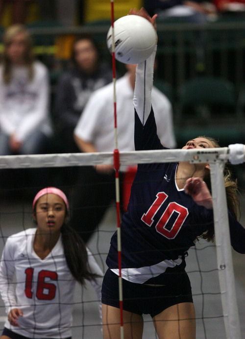 Leah Hogsten  |  The Salt Lake Tribune
Woods Cross' Lacey McEwan makes a kill. Woods Cross High School girls played Salem Hills High School during their girls 4A state volleyball quarterfinals Thursday, November 7, 2013 at Utah Valley University's UCCU Center.