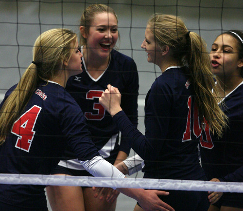 Leah Hogsten  |  The Salt Lake Tribune
Woods Cross' celebrates a point. Woods Cross High School girls played Salem Hills High School during their girls 4A state volleyball quarterfinals Thursday, November 7, 2013 at Utah Valley University's UCCU Center.