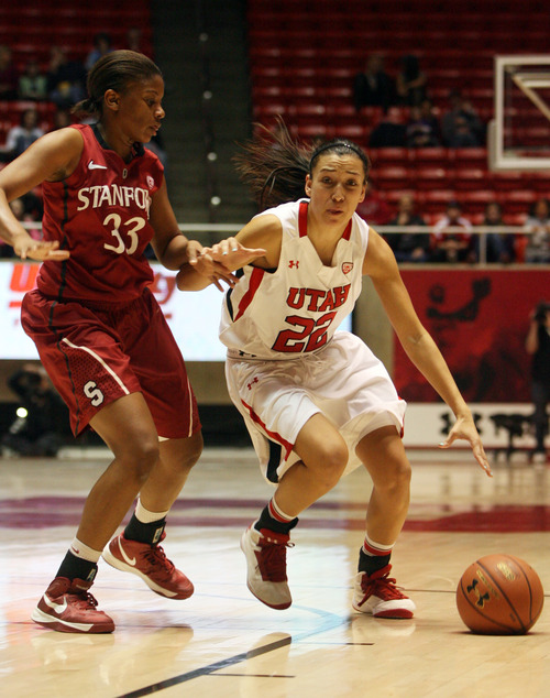 Kim Raff | The Salt Lake Tribune
(right) University of Utah player Danielle Rodriguez dribbles past Stanford player Amber Orrange during a game at the Huntsman Center in Salt Lake City on January 6, 2013. Stanford went on to win the game 70-56.