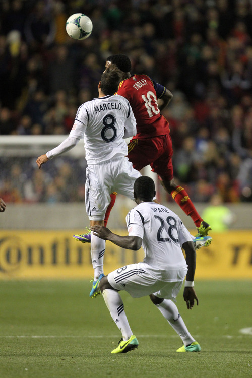 Francisco Kjolseth  |  The Salt Lake Tribune
Real Salt Lake forward Robbie Findley (10) stacks over Los Angeles Galaxy midfielder Marcelo Sarvas (8) and Los Angeles Galaxy defender Kofi Opare (28) as RSL takes on the LA Galaxy in the second game of the  Western Conference semifinal at Rio Tinto Stadium in Sandy UT, on Thursday, Nov. 7, 2013.
