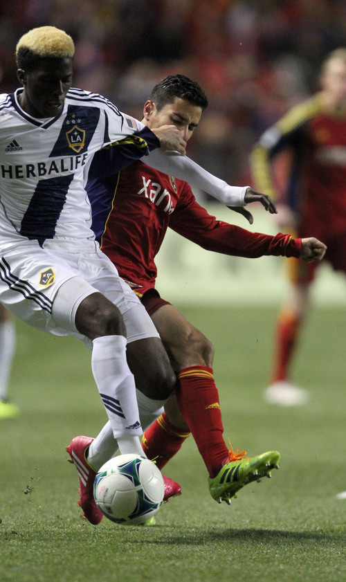 Francisco Kjolseth  |  The Salt Lake Tribune
Los Angeles Galaxy forward Gyasi Zardes (29) tangles with Real Salt Lake defender Tony Beltran (2) as RSL takes on the LA Galaxy in the second game of the  Western Conference semifinal at Rio Tinto Stadium in Sandy UT, on Thursday, Nov. 7, 2013.