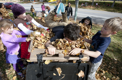 Steve Griffin  |  The Salt Lake Tribune


McGillis School students from kindergarten through eighth grade work together to rake leaves and clean-up yards for those who may need the extra help during the school's annual  "Fall Leaf Haul"  in the Douglas Neighborhood surrounding the school in Salt Lake City, Utah Friday, November 8, 2013.
