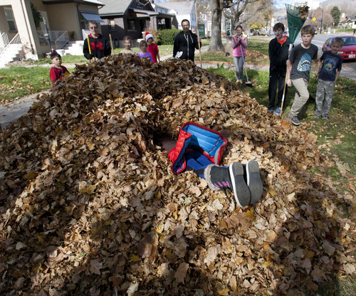 Steve Griffin  |  The Salt Lake Tribune


McGillis School students from kindergarten through eighth grade take turns jumping into the huge pile of leaves they worked together to rake during the school's annual  ìFall Leaf Haulî  in the Douglas Neighborhood surrounding the school in Salt Lake City, Utah Friday, November 8, 2013.