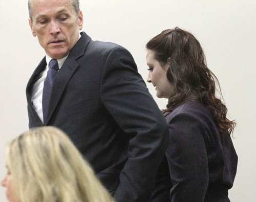 Al Hartmann  |  The Salt Lake Tribune
Gypsy Willis who carried on an affair with Martin MacNeill passes by him on the way to witness stand to testifify in his murder trial in 4th District Court in Provo Utah Thursday November 7,  2013.   She read portions of love letters the two exchanged while serving time in federal prison for document fraud.