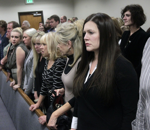 Al Hartmann  |  The Salt Lake Tribune
Alexis Somers, right, her sister Rachel MacNeill, upper right,  and family members rise for the jury to take their place for closing arguments on the final day of the murder trial for Pleasant Grove physician Martin MacNeill in Provo, Utah 4th District Court Friday November 8, 2013. .  MacNeill is  charged with murder for allegedly killing his killing his wife, Michele MacNeill, in 2007 so he could continue an extra-marital affair.