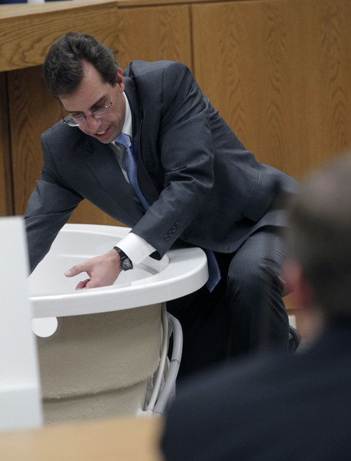 Al Hartmann  |  The Salt Lake Tribune
Defense lawyer Randy Spencer gives closing arguments before jury on the final day of the murder trial for Pleasant Grove physician Martin MacNeill in Provo, Utah 4th District Court Friday November 8, 2013.  He uses a bathtub similar to the one that Michele MacNeill was found in.  MacNeill is  charged with murder for allegedly killing his killing his wife, Michele MacNeill, in 2007 so he could continue an extra-marital affair.