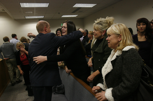 Scott Sommerdorf   |  The Salt Lake Tribune
Alexis Somer, center, hugs prosecutor Chad Grunander  after the court adjourned following the verdicts against Martin MacNeill were given. Martin MacNeill was found guilty of murder and obstruction of justice early Saturday morning, November 9, 2013.