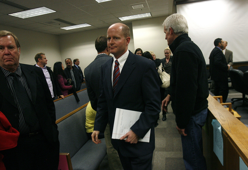 Scott Sommerdorf   |  The Salt Lake Tribune
Prosecutor Chad Grunander leaves the court room after Martin McNeill was found guilty of murder and obstruction of justice early Saturday morning, November 9, 2013.