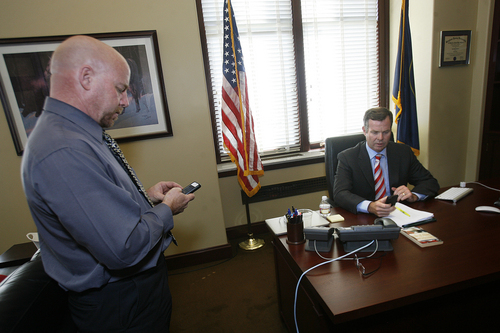 Scott Sommerdorf   |  The Salt Lake Tribune
Utah Attorney General John Swallow confers with his spokesman, Paul Murphy, left, in his office on the day it was announced the U.S. Department of Justice will not prosecute him, Thursday, September 12, 2013.