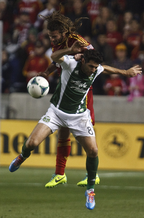 Leah Hogsten  |  The Salt Lake Tribune
Real Salt Lake midfielder Kyle Beckerman (5) and Portland Timbers midfielder Will Johnson (4) take a header. Real Salt Lake leads the Portland Timbers 1-0 at the half during their first leg of  the Western Conference final series Sunday, November 10, 2013 at Rio Tinto Stadium.