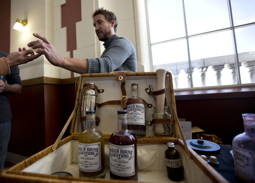 Lennie Mahler  |  The Salt Lake Tribune
Kenny Byron serves gourmet syrup samples at the Sugar House Libations booth in the Winter Farmers Market on Saturday, Nov. 9, 2013. The market runs from 10 a.m. to 2 p.m. every other Saturday at the Rio Grande Depot in downtown Salt Lake City.