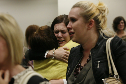 Scott Sommerdorf   |  The Salt Lake Tribune
Alexis Somer, center, is hugged after the court adjourned following the vedicts against Martin MacNeill were given. Martin MacNeill was found guilty of murder and obstruction of justice early Saturday morning, November 9, 2013.