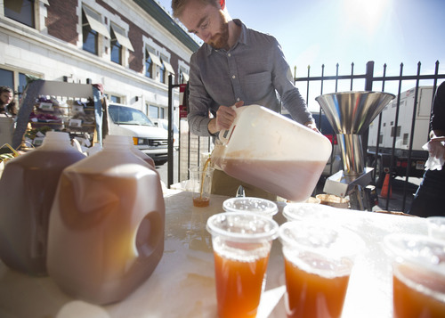 Lennie Mahler  |  The Salt Lake Tribune
James Rasmussen serves up fresh pressed apple cider at the Winter Farmers Market on Saturday, Nov. 9, 2013. The market runs from 10 a.m. to 2 p.m. every other Saturday at the Rio Grande Depot in downtown Salt Lake City.