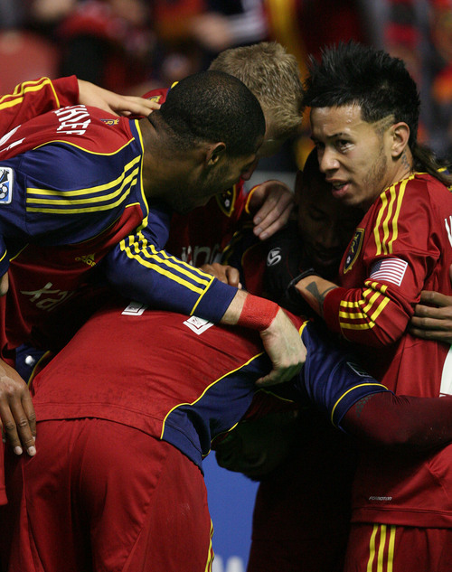Leah Hogsten  | The Salt Lake Tribune
Real Salt Lake midfielder Javier Morales (11) and his teammates celebrates his goal. Real Salt Lake defeated the Portland Timbers 4-2  during their first leg of the Western Conference final series Sunday, November 10, 2013 at Rio Tinto Stadium.