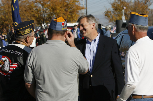 Francisco Kjolseth  |  The Salt Lake Tribune
Congressman Jim Matheson meets with veterans prior to the start of the Taylorsville Veterans Parade on Monday, Nov. 11, 2013, as part of Veterans Day events around the state. Congressman Matheson was the keynote speaker at Taylorsville's City Hall following the event.