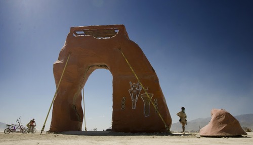 Rick Egan  | The Salt Lake Tribune 

The PsycheDelicate Arch at Burning Man, Thursday, August 29, 2013. Built by Utah's regional burners, the arch went up in flames later that night with the other regional effigies.