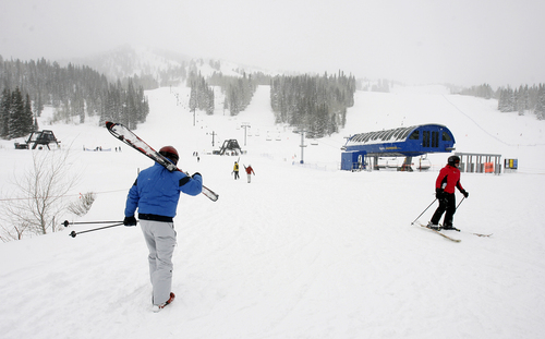 Tribune file photo by Steve Griffin
A skier walks to the base of a lift at Solitude Mountain Resort in Big Cottonwood Canyon.