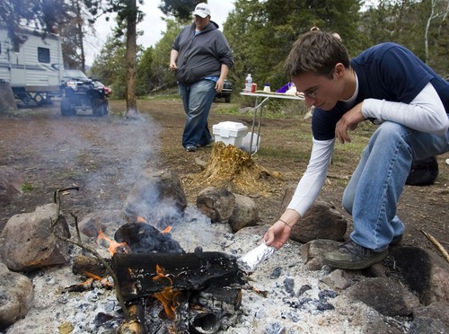 Nate Falslev of American Fork , right, and Adam Heath of West Valley City prepare to cook food at their camp, near the entrance of the Soapstone Campground on the Mirror Lake Byway. A recently released study by The Outdoor Foundation sponsored by The Coleman Company said that 38 million Americans, about 13 percent of the population over age 6, went camping at least once last year. However, camping participation is down from 2011, when 42.5 million Americans, or 15 percent of the U.S. population, camped. Tribune File Photo