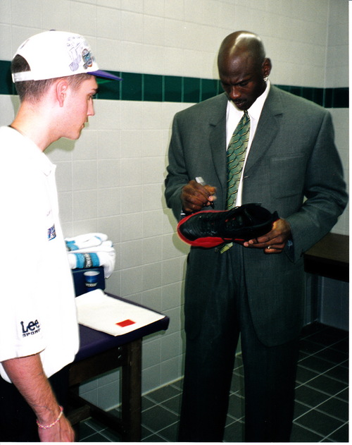 Courtesy of Preston Truman
Michael Jordan signs his "Flu Game" shoes for former Utah Jazz ballboy Preston Truman before leaving the arena on June 11, 1997.