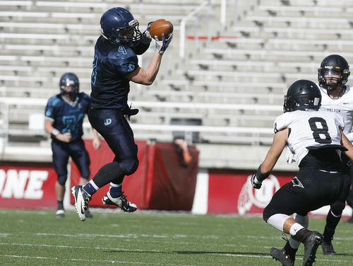 Scott Sommerdorf   |  The Salt Lake Tribune
Juan Diego RB Jesse Springer makes a leaping catch during first  half play. Juan Diego held a 21-7 lead over Pine View at the half, Thursday, November 14, 2013.