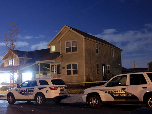 Michael Mangum  |  Special to the Salt Lake Tribune

Squad cars from both the South Jordan Police Department and West Jordan Crime Scene Unit are shown outside a home in the Daybreak community where authorities found 2 dead bodies earlier in the evening on Friday, November 15th, 2013. Authorities say that around 4:30pm it was reported that shots were fired in the home.