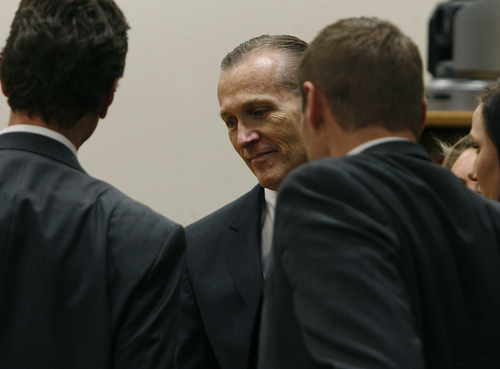 Scott Sommerdorf   |  The Salt Lake Tribune
Martin MacNeill greets his defense team as he enters the courtroom after the jury reached a verdict. MacNeill was found guilty of murder and obstruction of justice early Saturday morning, November 9, 2013.