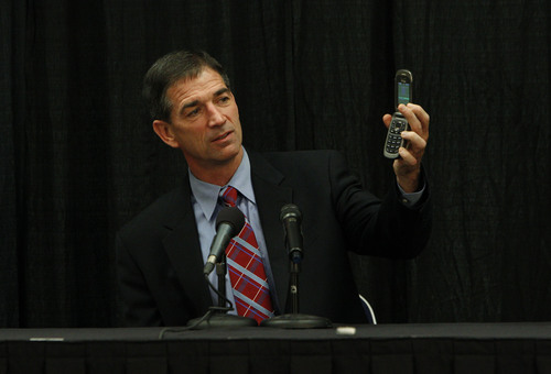 Francisco Kjolseth  |  The Salt Lake Tribune
Former Utah Jazz player John Stockton demonstrates his lack of tech savviness by pulling out his clam shell phone following a question about Twitter as he holds a press conference at Energy Solutions Arena to promote his new book on Friday, Nov. 15, 2013.