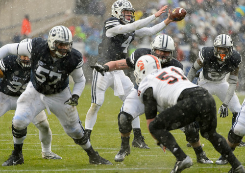 Trent Nelson  |  The Salt Lake Tribune
Brigham Young Cougars quarterback Taysom Hill (4) takes the snap as BYU hosts Idaho State, college football at LaVell Edwards Stadium in Provo, Saturday November 16, 2013.