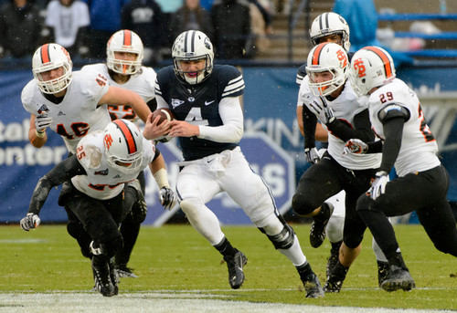 Trent Nelson  |  The Salt Lake Tribune
Brigham Young Cougars quarterback Taysom Hill (4) runs the ball as BYU hosts Idaho State, college football at LaVell Edwards Stadium in Provo, Saturday November 16, 2013.
