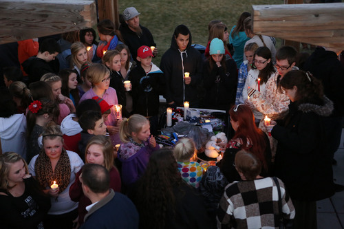 Francisco Kjolseth  |  The Salt Lake Tribune
People gather in South Jordan at Firmont Park for a candelight vigil on Sunday, Nov. 17, 2013, in memory of Taylor Wheeler, 12, and Dayton Gessell, 15, after the two were found dead in a home in Daybreak on Friday.