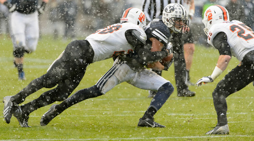 Trent Nelson  |  The Salt Lake Tribune
Brigham Young Cougars wide receiver Skyler Ridley (17) is stopped by Idaho State Bengals defensive back Cameron Gupton (28) as BYU hosts Idaho State, college football at LaVell Edwards Stadium in Provo, Saturday November 16, 2013.