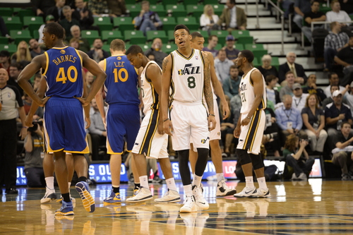 Rick Egan  | The Salt Lake Tribune 

A frustrated Utah Jazz point guard Diante Garrett (8) looks up at the clock as the Jazz trailed the Golden State Warriors by a large margin near the end of the game, at the EnergySolutions Arena, Monday, November 18, 2013.