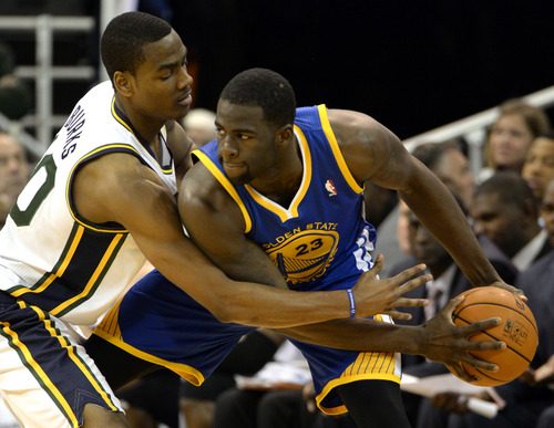 Rick Egan  | The Salt Lake Tribune 

Utah Jazz point guard Alec Burks (10) puts pressure on The Warriors, Draymond Green (23), as The Utah Jazz faced The Golden State Warriors, at the EnergySolutions Arena, Monday, November 18, 2013.  Curry did not return to the game after the play.