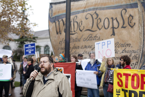 Jim McAuley | The Salt Lake Tribune
Arthur Stamoulis, executive diretor of the Citizens Trade Campaign, gathers with demonstrators to protest the Trans-Pacific Partnership talks at the Grand America Hotel in Salt Lake City on Tuesday, November 19, 2013.