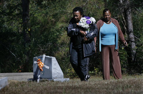 Scott Sommerdorf   |  The Salt Lake Tribune
Johnnie Mae Martin arrives to place some flowers at the grave of her son, David Martin III in Monticello, Mississippi, Wednesday November 20, 2013. She, along with family and friends gathered to have a final ceremony at the graveside of David who was killed by Joseph Franklin in Salt Lake City in 1980. Franklin was executed in Missouri about five hours earlier.