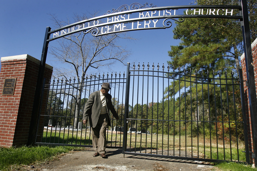 Scott Sommerdorf   |  The Salt Lake Tribune
Johnnie Mae Martin's friend James Hill closes the gate to the Monticello Baptist Cemetery after Johnnie Mae Martin and her friends and relatives had a brief service beside her son David's grave, Wednesday November 20, 2013. His killer, Joseph Franklin was executed about five hours earlier in Missouri.