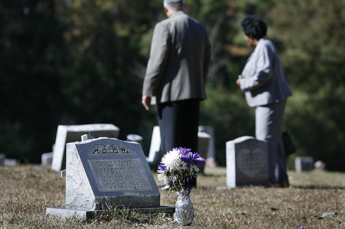 Scott Sommerdorf   |  The Salt Lake Tribune
Friends and family of Johnnie Mae Martin walk among the other graves in the the segregated cemetery in Monticello, Mississippi, Wednesday November 20, 2013. They had gathered to have a final ceremony at the grave of David Martin III who was killed by Joseph Franklin in 1980. Franklin was executed in Missouri about five hours earlier.