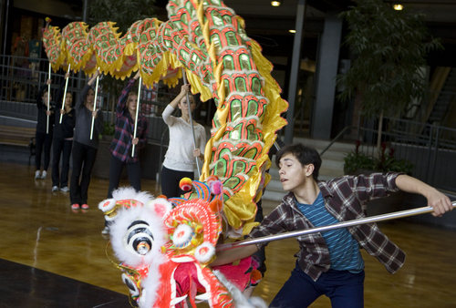 Keith Johnson | The Salt Lake Tribune

Stephen Nakagawa and other dancers from Ballet West 2 rehearse with a 36-foot dragon at Trolley Square in Salt Lake City, Nov. 20, 2013. The dragon is s a new element in a Chinese variation of this season's production of "The Nutcracker."