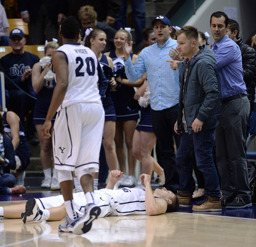 Steve Griffin  |  The Salt Lake Tribune


After missing a last second shot BYU's Kyle Collinsworth lies on the floor as time expires during second half action in the BYU versus Iowa State men's basketball game at the Marriott Center in Provo, Utah Thursday, November 21, 2013.