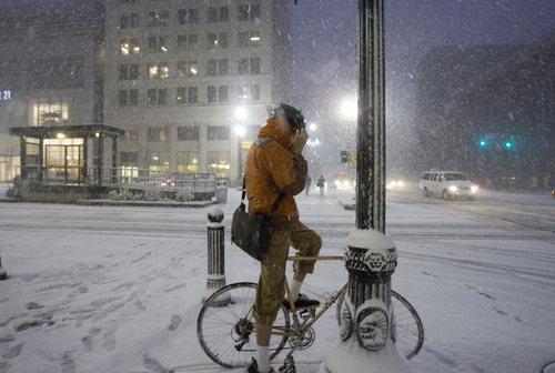 Kim Raff | The Salt Lake Tribune
A bike rider adjusts himself at a cross walk during heavy snow on Main Street during the evening commute in downtown Salt Lake City on January 10, 2013.