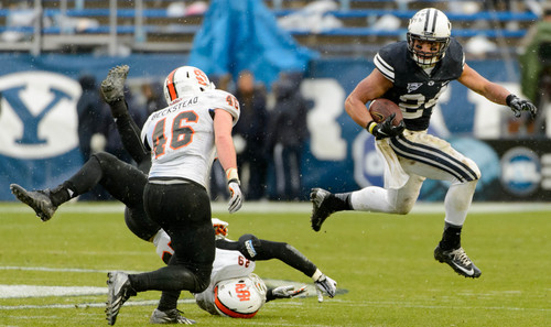 Trent Nelson  |  The Salt Lake Tribune
Brigham Young Cougars running back Algernon Brown (24) runs the ball as BYU hosts Idaho State, college football at LaVell Edwards Stadium in Provo, Saturday November 16, 2013.