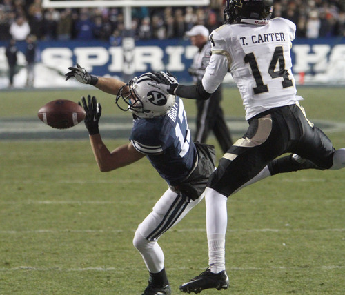 Rick Egan  | The Salt Lake Tribune 

Brigham Young Cougars wide receiver Skyler Ridley  is hit by (17) Tracey Carter of the Vandals on a touchdown pass attempt, in football action, at Lavell Edwards Stadium, Saturday, November 10, 2012