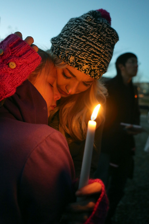 Francisco Kjolseth  |  The Salt Lake Tribune
Kendyll Stewart, left, is comforted by Tayler Nicole, sister and stepsister to Taylor Wheeler, 12, who was found dead in a home in Daybreak on Friday. The two were surrounded by friends and family as they gathered in South Jordan at Firmont Park for a candelight vigil on Sunday, Nov. 17, 2013, in memory of Taylor and Dayton Gessell, 15, after the two were found dead in a home in Daybreak on Friday.